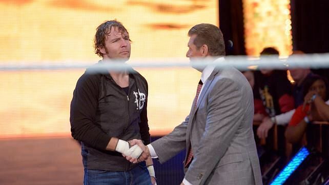 Dean Ambrose shaking hands with Vince McMahon