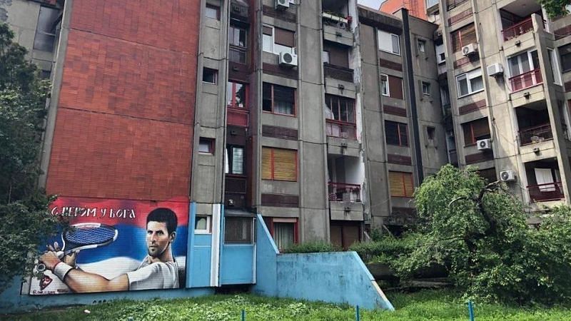 Novak Djokovic's apartment building in Belgrade during the war times, which now has his mural. Credits: BBC