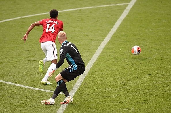 Jesse Lingard steals the ball from Schmeichel