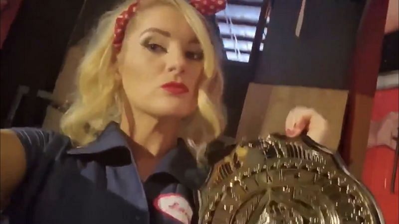 Lacey Evans with AJ Styles&#039; Intercontinental Championship