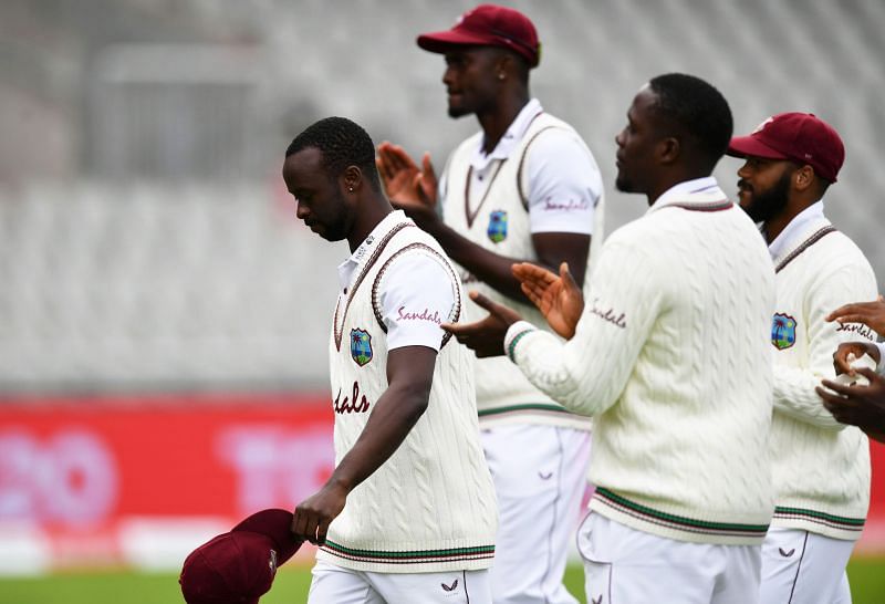 Kemar Roach leads his team off the field