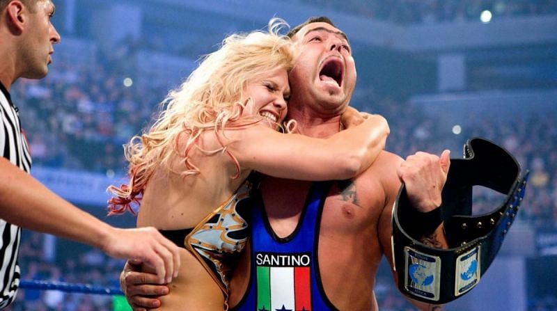 Beth Phoenix and Santino Marella celebrate in the WWE ring 