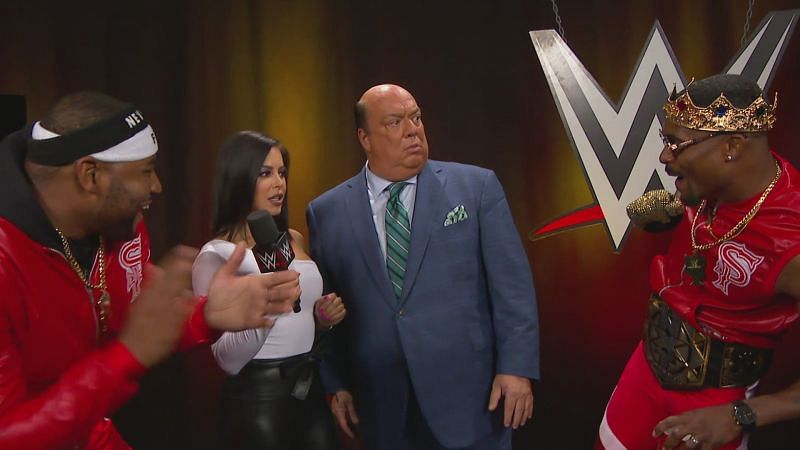 Paul Heyman backstage with Montez Ford and Angelo Dawkins