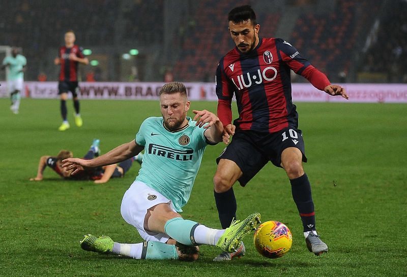 Milan Skriniar of FC Internazionale tackles Nicola Sansone of Bologna FC&nbsp;