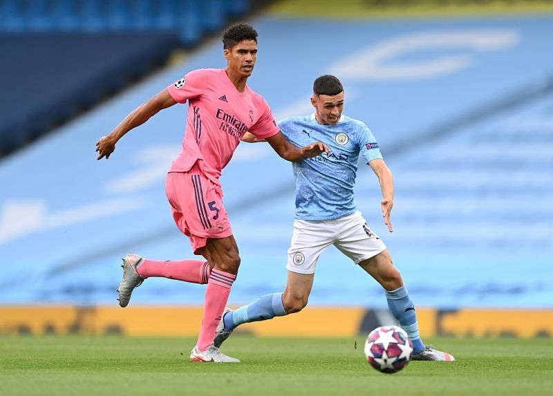 Manchester City talent Foden tussling with Varane, where he began in an unfamiliar false nine role
