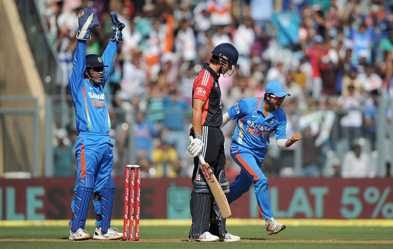 MS Dhoni celebrates the wicket of Alastair Cook.