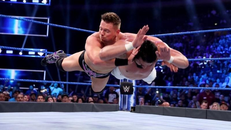 The Miz planting Andrade with the Skull Crushing Finale