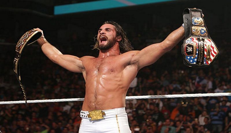 Seth Rollins holds his titles