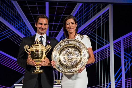 Roger Federer (L) and Garbine Muguruza at the Wimbledon 2017 Champions Dinner