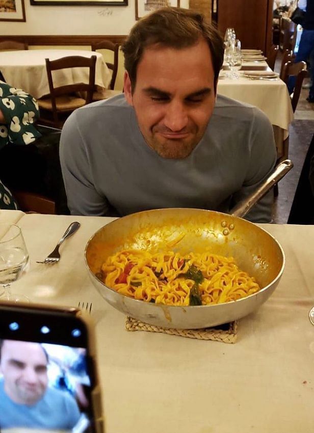 Roger Federer before digging into a portion of pasta