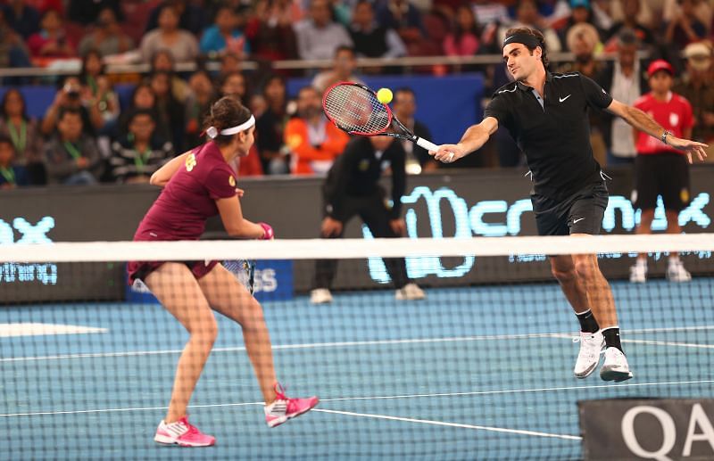 Roger Federer and Sania Mirza in action during IPTL 2014