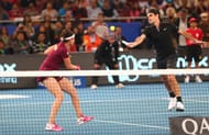 Roger Federer and Sania Mirza in action during IPTL 2014