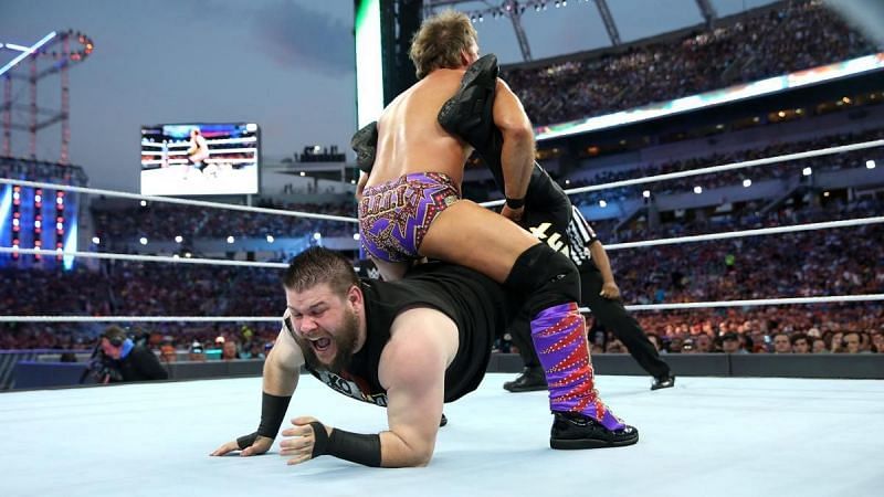 Chris Jericho locks in the Walls of Jericho on Kevin Owens