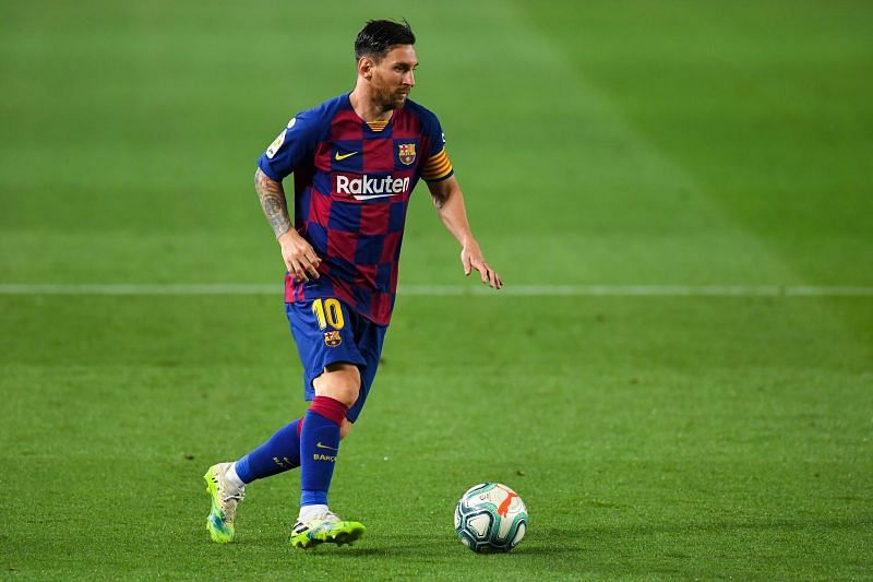 Lionel Messi of FC Barcelona runs with the ball