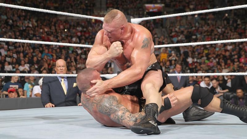 Brock Lesnar pummeling Randy Orton