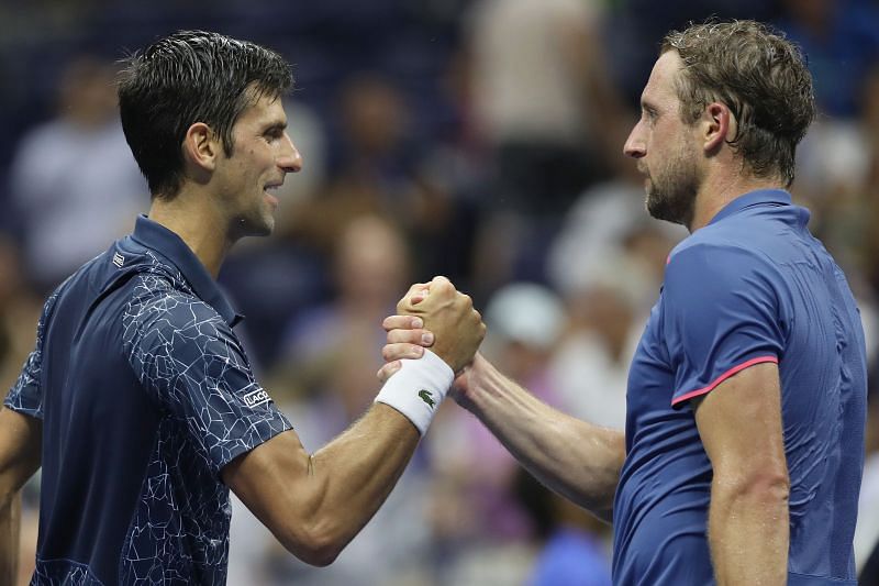 Novak Djokovic (L) and Tennys Sandgren at the 2018 US Open