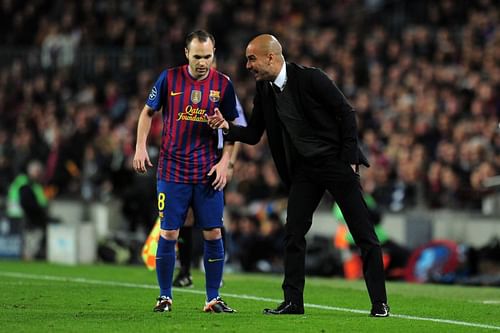 Pep Guardiola gives instructions to Iniesta during his stint as the manager of Barcelona