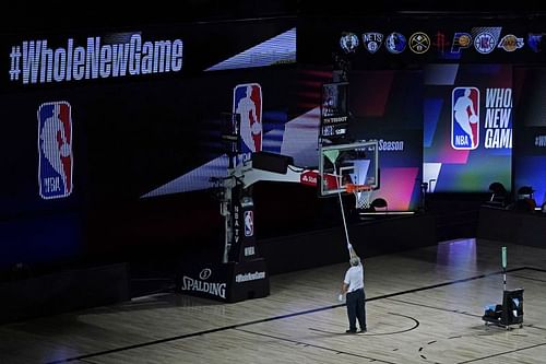 NBA staff sanitising the arena before a game