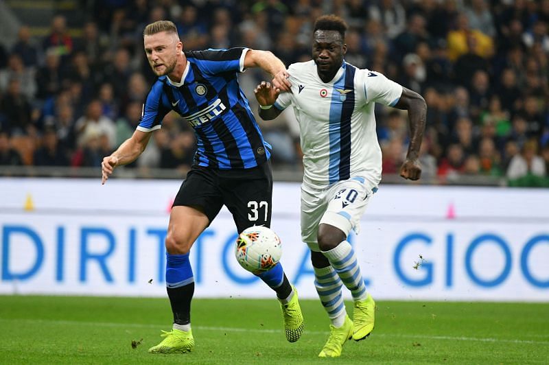 Milan Skriniar of FC Internazione compete for the ball with Felipe Caicedo of SS Lazio