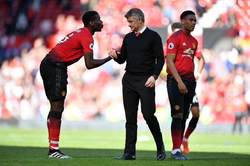 Ole Gunnar Solskjaer, Manager of Manchester United shakes hands with Paul Pogba