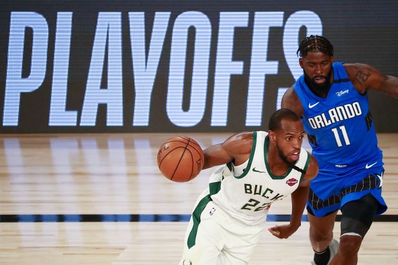 Khris Middleton in action for the Milwaukee Bucks Nikola Vucevic in action for the Orlando Magic