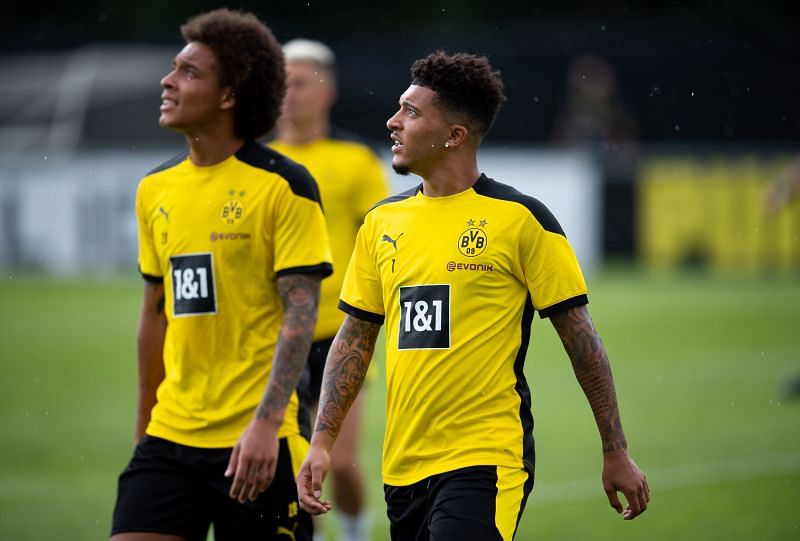 Jadon Sancho (R) and Axel Witsel (L) react during pre-season summer training
