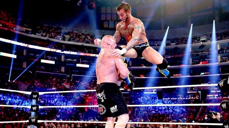 CM Punk striking Lesnar with a flying knee at SummerSlam 2013