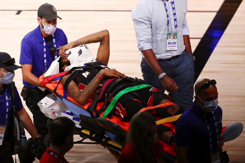 Derrick Jones Jr. being stretchered off