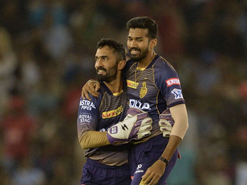 Sandeep Warrier celebrates the fall of a wicket with Dinesh Karthik [PC: TOI]
