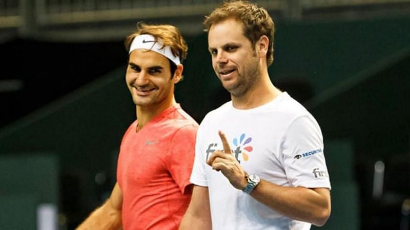 Roger Federer (left) with Severin Luthi during a practice session