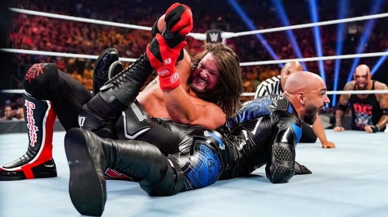 AJ Styles applying the Calf Crusher on Ricochet