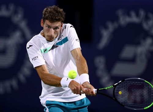 Pablo Carreno Busta hits a backhand