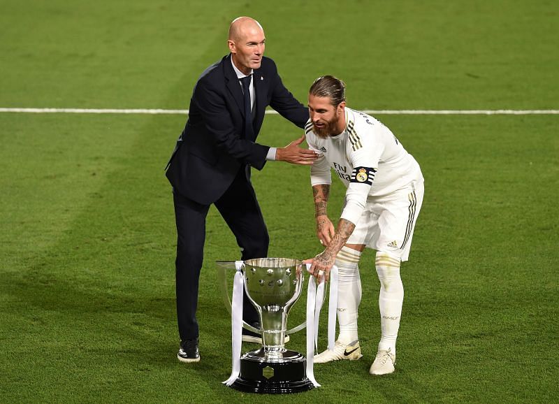 Real Madrid head coach Zinedine Zidane and captain Sergio Ramos pose with the La Liga trophy