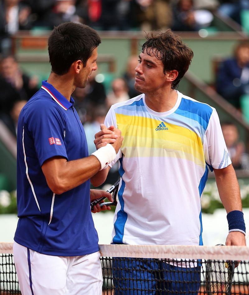 Novak Djokovic (L) and Guido Pella at the 2013 French Open