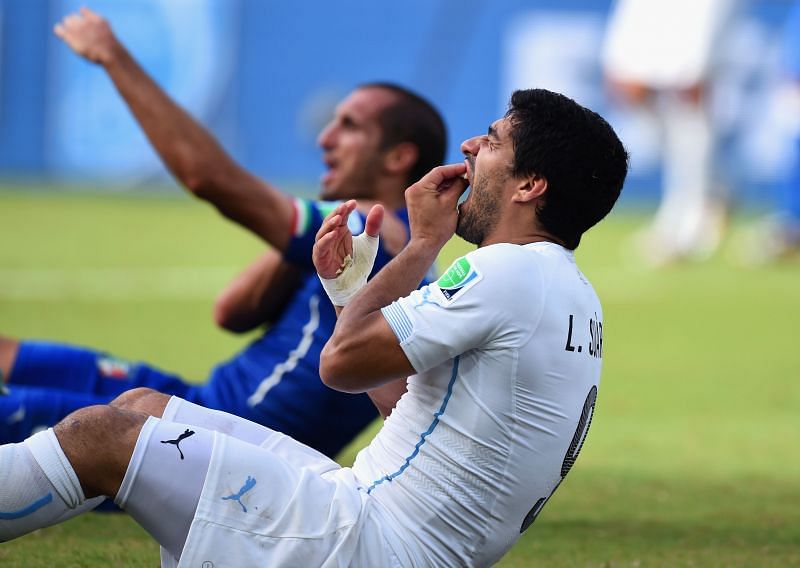 Suarez and Chiellini react after the infamous biting incident