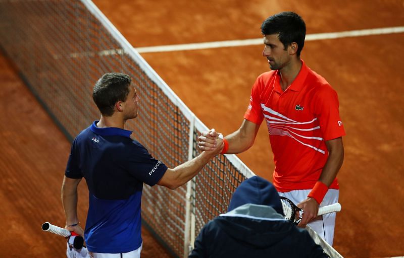 Diego Schwartzman (L) and Novak Djokovic at Rome Masters 2019