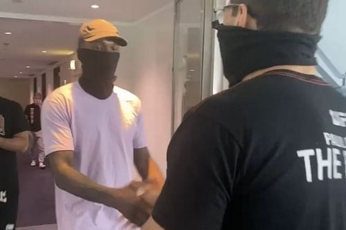 Israel Adesanya shaking hands with Paulo Costa.