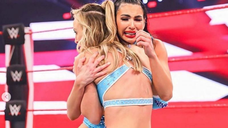 Billie Kay and Peyton Royce hug in WWE after they lost a match and broke up