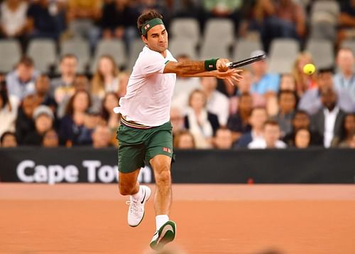 Roger Federer hits a running forehand