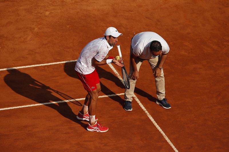 Novak Djokovic argues with the umpire over a line call in his semifinal match.