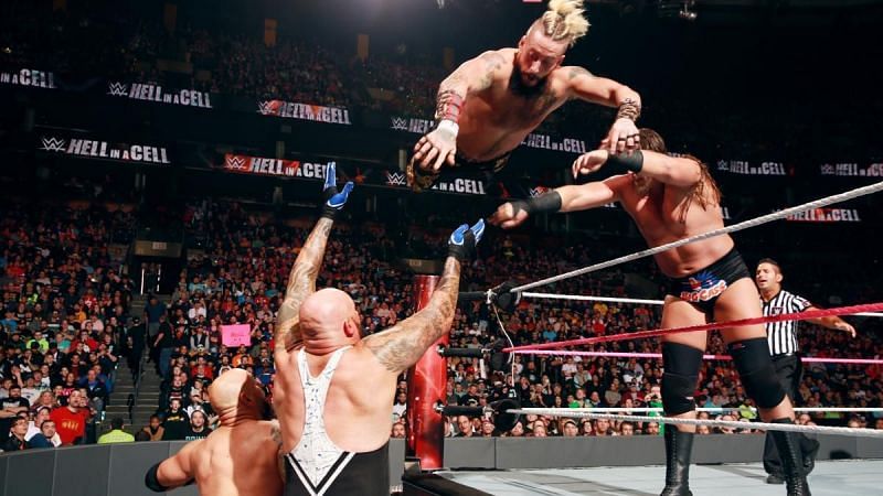 Enzo Amore wrestling with Gallows and Anderson in WWE