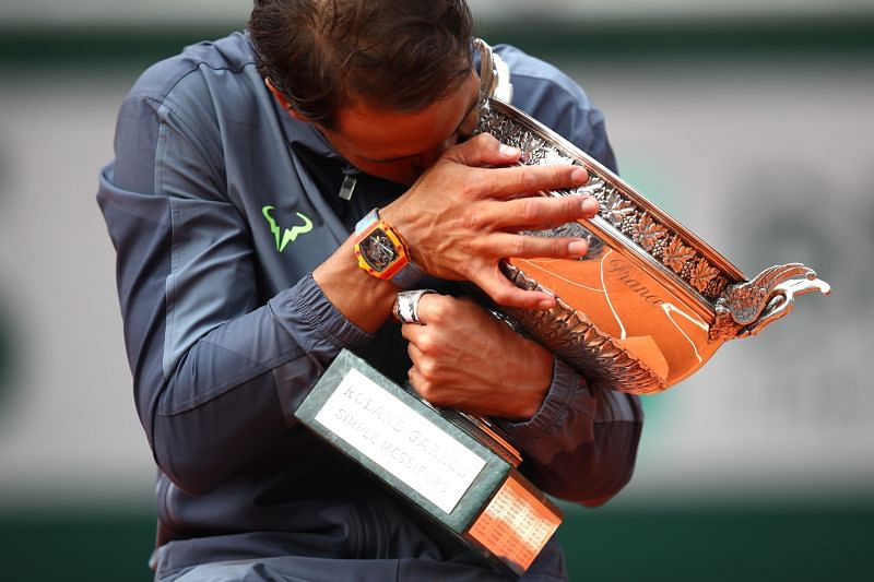 Rafael Nadal of Spain celebrates with the trophy following the men&#039;s singles final at the 2019 French Open