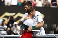 Diego Schwartzman (L) and Novak Djokovic at the 2020 Australian Open