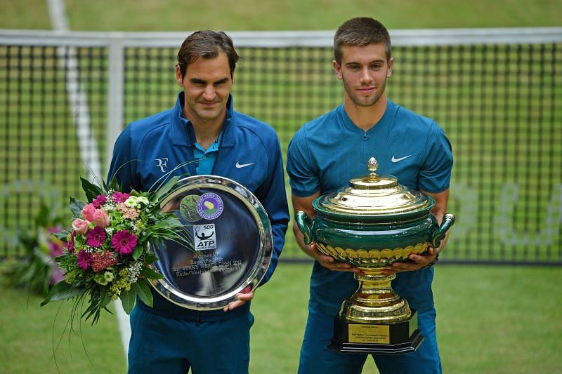 Borna Coric poses with the 2018 Halle Open trophy