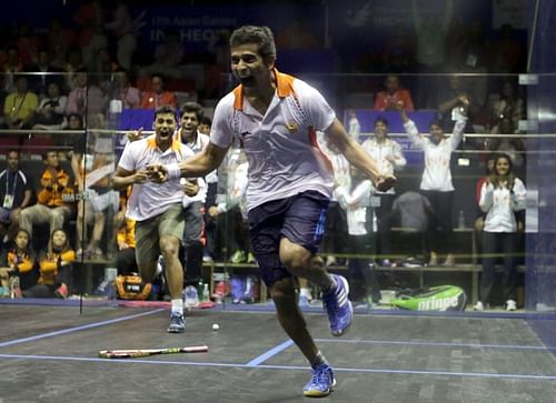 Saurav Ghosal celebrating the men's team event gold at the 2014 Asian Games