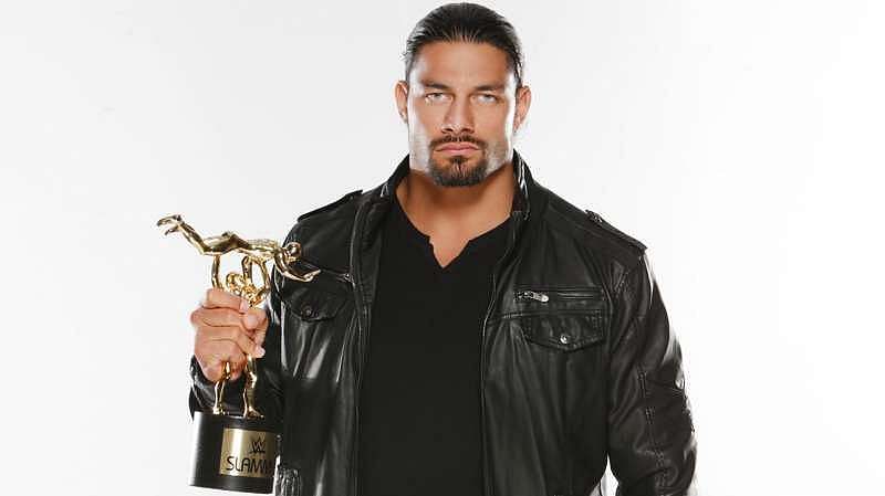 Roman Reigns with the Slammy award