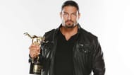 Roman Reigns with the Slammy award