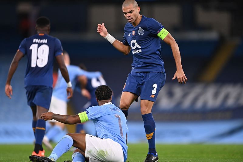 Pepe of FC Porto clashes with Raheem Sterling of Manchester City