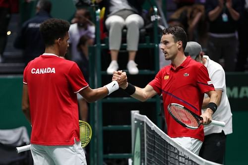 Felix Auger-Aliassime (L) and Roberto Bautista Agut