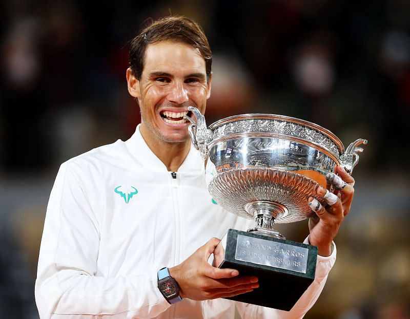 Rafael Nadal bites the trophy following his victory in the 2020 French Open final